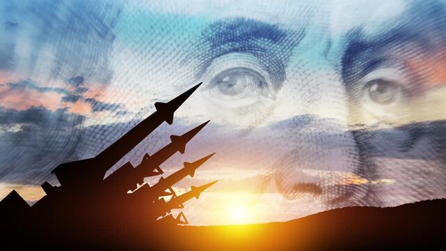 The missiles are aimed to the sky at sunset. The missiles on background of US dollar. Nuclear bomb, chemical weapons, missile defense, a system of salvo fire.