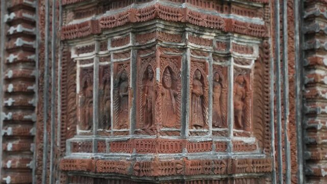 This temple is part of the Kalna Rajbari Temple complex, and its walls feature various types of intricate carvings.