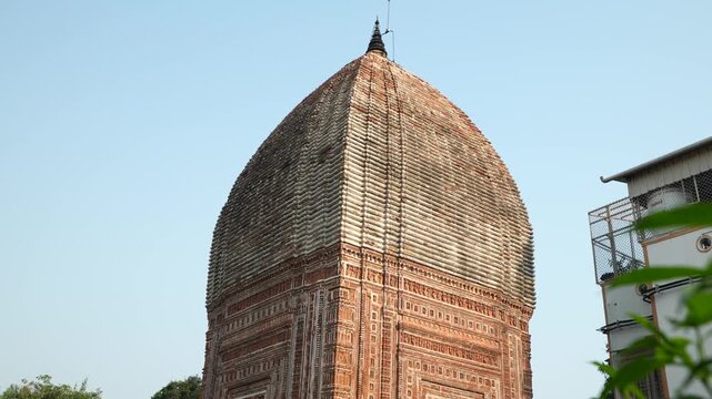 This temple is part of the Kalna Rajbari Temple complex, and its walls feature various types of intricate carvings.