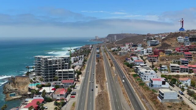 Drone flyover of Transpeninsular Highway near Christ of the Sacred Heart and Las Rocas Resort, Rosarito