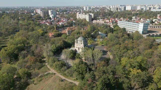 Old Iconic Cenusa Crematorium Bucharest City Surrounded By Trees Morning Romania Drone Pull Back Focus 4K 30FPS