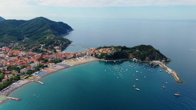 Dozens of boats dot the bay at Sestri Levante, framed by green headlands.