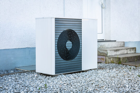 Split heating and cooling pump installed in front of family house