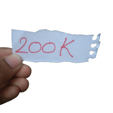 Hand holding a piece of paper with 200k written on it isolated on transparent background