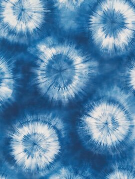 indigo blue tie-dye fabric with radiating white sunburst circles, playful and soothing textile pattern