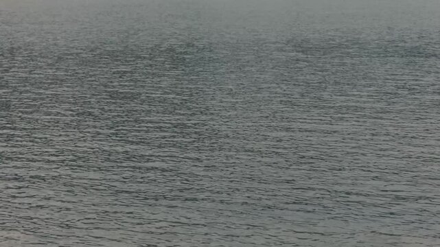 Gray ripples on the water surface