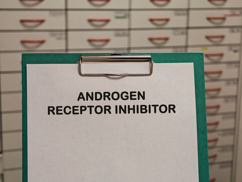 ANDROGEN RECEPTOR INHIBITOR for prostate cancer androgen suppression and hormonal cancer treatment displayed on a clipboard in a pharmacy