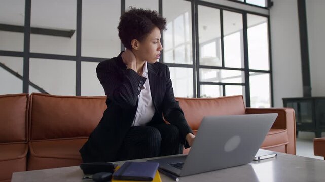 Businesswoman Experiencing Neck Strain While Working