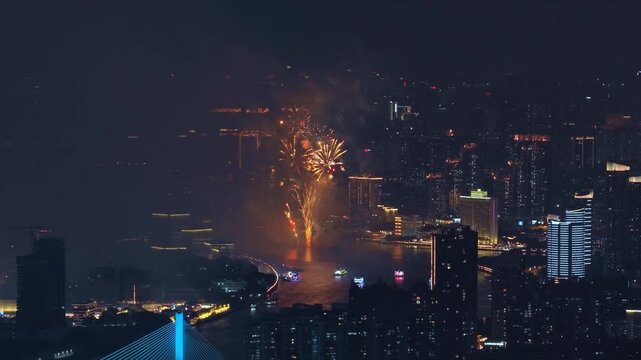 Aerial top drone view grand multi-colored fireworks display night sky over modern city. Beautiful gorgeous firecracker background. People celebrate holiday. New Year festival party. Pyrotechnics show.
