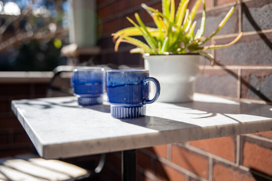 Cozy Morning Coffee Cups Outdoor Patio Setting