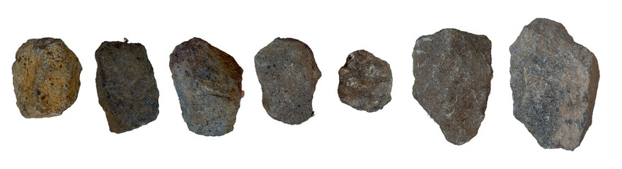 Collection of natural rough stone rocks isolated on a clean white background. © upen