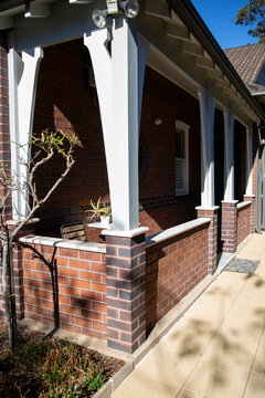 Charming Brick House Porch Sunlit Exterior View