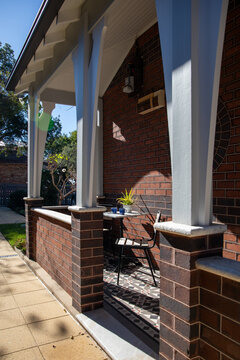 Charming Brick House Porch With Outdoor Seating