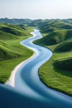 serene meandering river winding through lush rolling green hills under pale sky