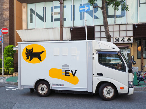 CHIBA, JAPAN - July 15, 2026: A Yamato Transport Company (Kuroneko) electric truck making a delivery in Ichikawa City in Chiba Prefecture.