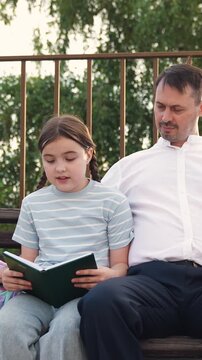 child kid girls reading book father, parent with child kid girls sitting bench park, child kid girl reading book textbook, happy family, man child relaxing outdoor, family nature, happy father concept