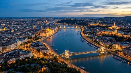 Obraz premium Budapest aerial view at dusk with Danube river and illuminated Chain Bridge