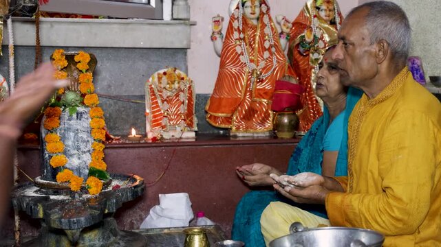Senior Hindu Worshipper Performing Traditional Shiva Puja With Sacred Vibhuti Ritual