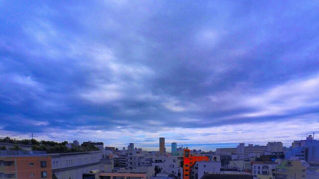 Timelapse of dramatic clouds drifting over Tokyo cityscape at dusk, Ikejiri-Ohashi and Nakameguro