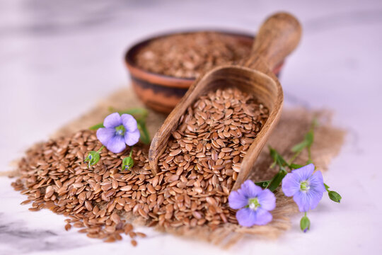 Beneficial flax seeds in a clay bowl. Close-up.
