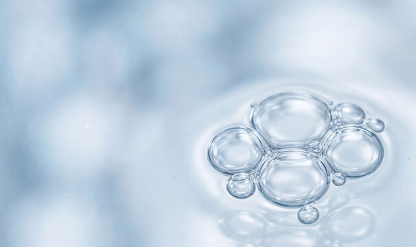 Macro shot of crystal clear water bubbles on surface