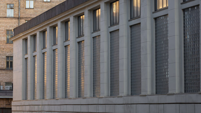 Window openings with glass blocks on the main building "Workshop" in the public space "Supermetal." The former building of the I.P. Bardin Central Research Institute of Ferrous Metallurgy