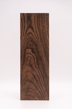 A close up of dark wood grain.