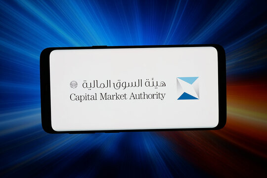 Stuttgart, Germany - 07-16-2026: In this photo illustration, the logo of Saudi regulator Capital Market Authority (CMA) is displayed on a smartphone in front of abstract background on computer screen.