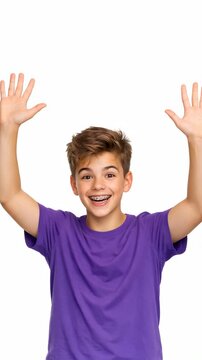 A young man in a purple shirt expressing joy with his arms up in the air, showing a smile on his face. The background is plain and nondescript, emphasizing the subject's emotion.
