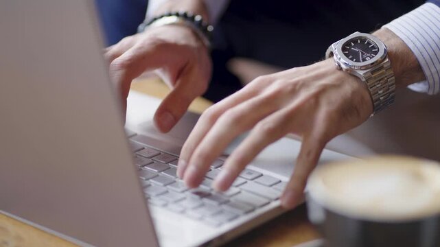 working on laptop close up hands