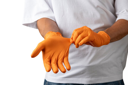 Person wearing orange nitrile gloves for hand protection