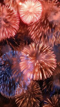 Colorful fireworks exploding in the night sky on a dark background, vertical video featuring vibrant celebrations for New Year, festivals and special events