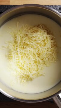 Grated cheese stirs into sauce, forming smooth cheese sauce. Cheese sauce turns simple mac and cheese into rich comfort food. Homemade cheese sauce recipe adds cozy flavor to family dinner.