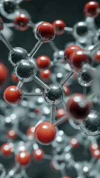 An up-close view of an atomic lattice with red and silver elements.