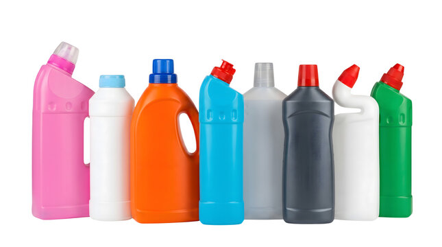 Colorful plastic detergent bottles with various caps lined up against a white background