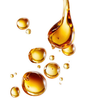Golden honey syrup droplets and flowing viscous liquid isolated with glossy reflections