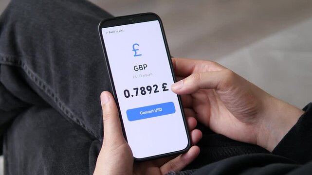 Hand transitioning from a general currency list to a focused GBP detail screen. The shift emphasizes the depth of data available. Perfect for data visualization, multi-level UX, and financial software