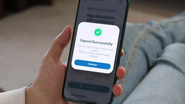 Mobile confirmation of a successful e-signature highlights trusted online paperwork, legal digital approval and the shift toward seamless remote document management.