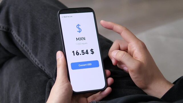 User reviewing the current MXN to USD exchange rate of 16.54. The clear number is essential for business operations. Ideal for Latin American trade, corporate finance, and cross-border commerce stock