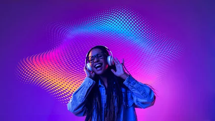 Smiling woman enjoying headphones with colorful digital sound waves. Concept of joyful music experience, streaming service advertising, music festival promotion. © master1305