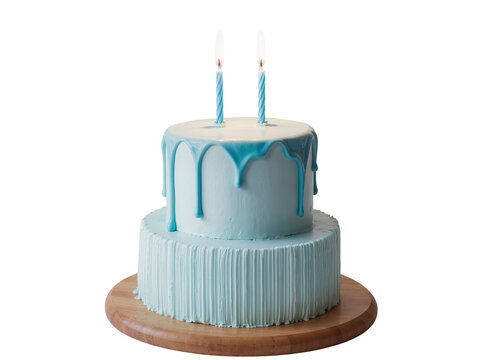 Isolated two-tier blue birthday cake with drip icing and two lit candles on a wooden stand