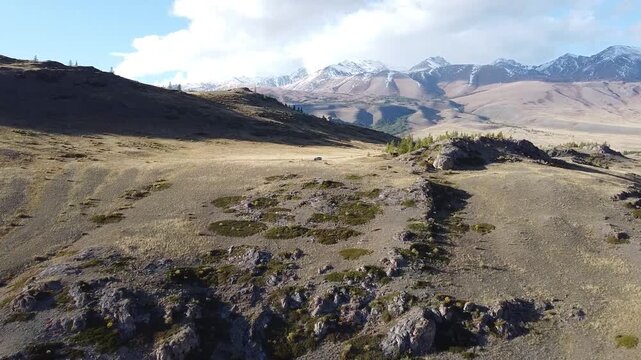 Aerial view of Aktru Mountains in Altai Republic Russia, North Chuya Range with snow capped peaks. Concept: alpine wilderness