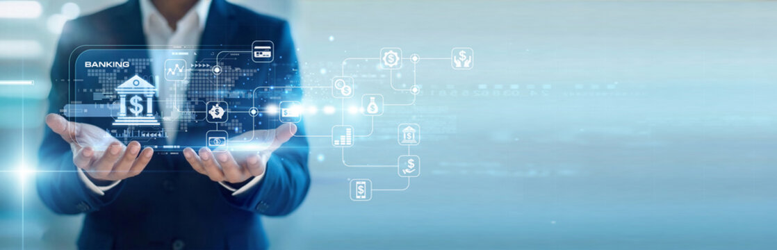 Financial advisor handhold virtual screen for Banking transactions while working on laptop to manage wealth. Secure digital finance management and personalized investment portfolio growth.