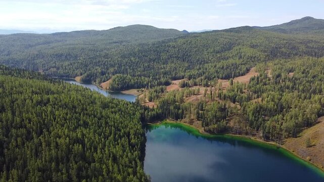 Aerial view of Uzun Kol Lake near Aktash Altai Republic Russia, mountain taiga landscape. Concept: Altai travel destination