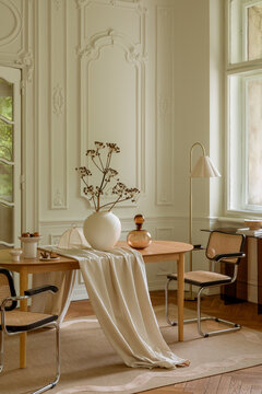 Elegant dining room interior with classic decor and modern furniture in a bright, inviting atmosphere