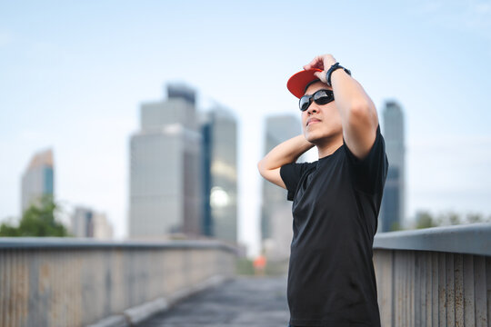 Adult asian athlete man runner training for marathon challenge male wear sports outfit running workout exercise at outdoors urban lifestyle