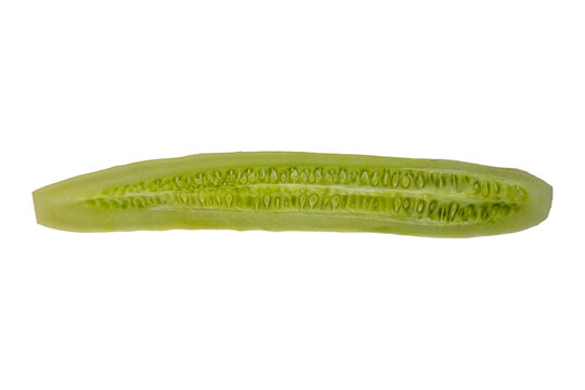 Closeup pickle spear slice showing cucumber seeds and glossy texture