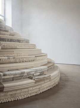 Curving Staircase Built From Stacked Folded Linen Textiles