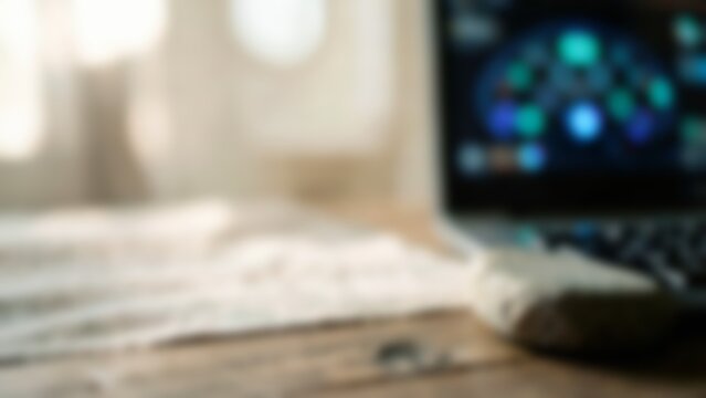 Blurred laptop with data dashboard on desk for AI website background