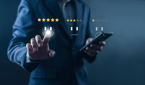 Businessman selecting five star customer satisfaction rating on virtual interface, positive feedback, online review, customer experience survey, service quality evaluation and reputation management.